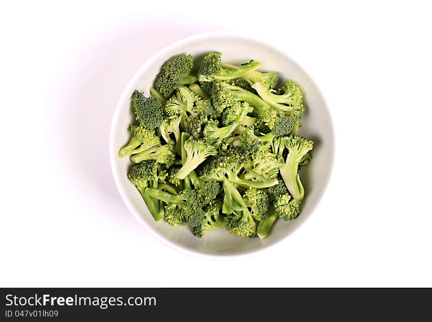 Broccoli in a bowl isolated on white background