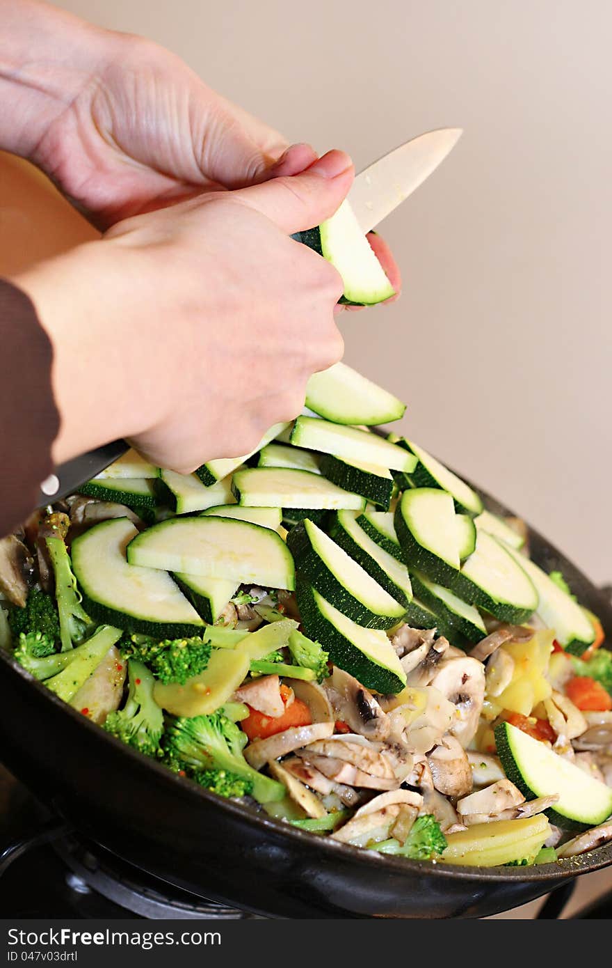 Preparing vegetarian food in wok pan