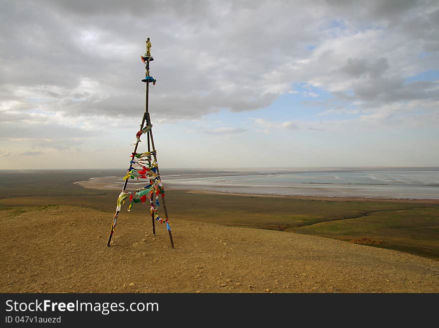 Triangulation mark with buddhist prayer flags