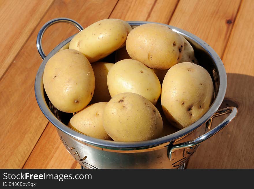 Ceasar potatoes in a stainless steel colander, Andalusia, Spain, Western Europe. Ceasar potatoes in a stainless steel colander, Andalusia, Spain, Western Europe.