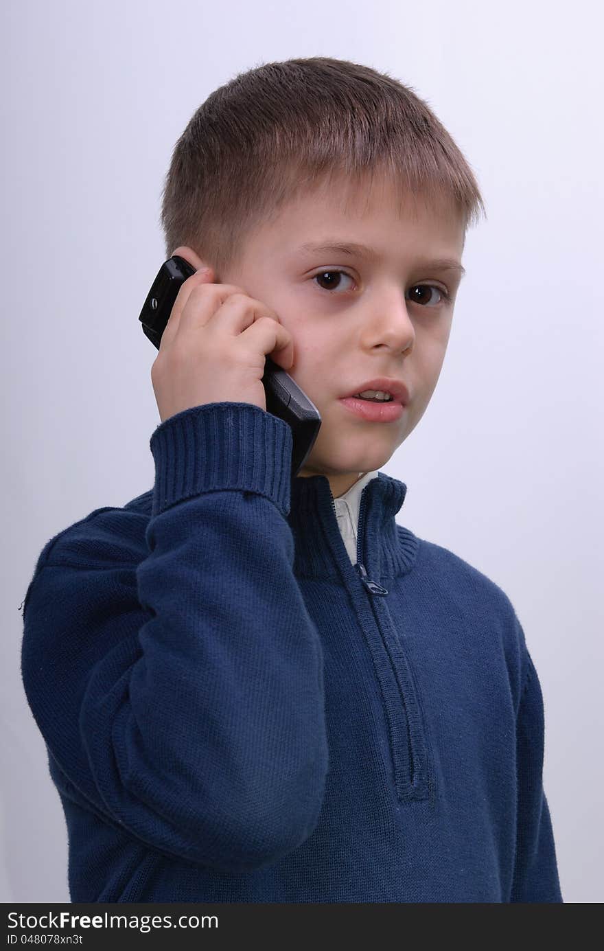 A child speaks by phone.