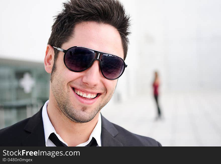 Attractive young businessman laughing