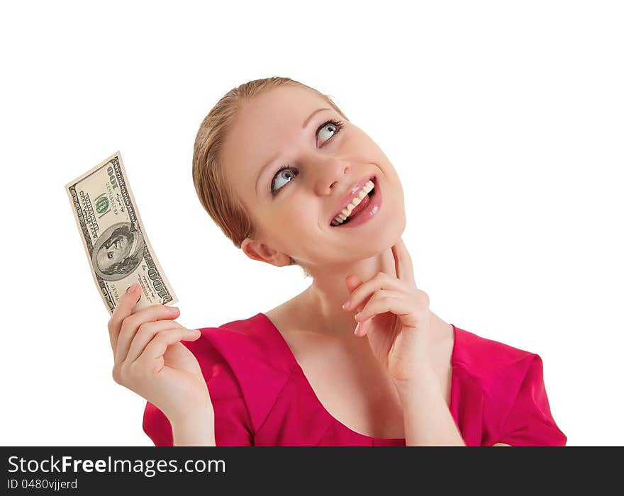 Cheerful dreamy girl in a red blouse holds the money, American dollars isolated on a white background. Cheerful dreamy girl in a red blouse holds the money, American dollars isolated on a white background