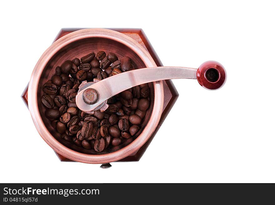 Old wooden worm eaten coffee mill isolated on a white background. Old wooden worm eaten coffee mill isolated on a white background