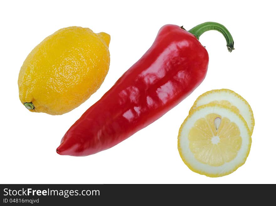 Lemon and piece of a lemon with the red pepper, isolated on the white. Lemon and piece of a lemon with the red pepper, isolated on the white