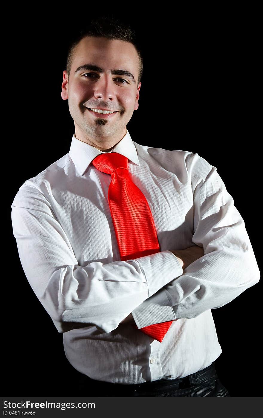 Portrait of smiling young businessman wearing red necktie