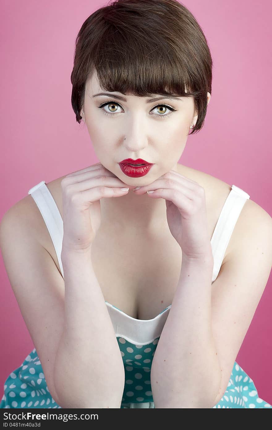 Cute pin up model with full lips and pixie haircut