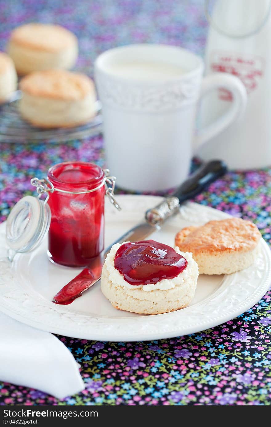 Scone with plum jam, selective focus