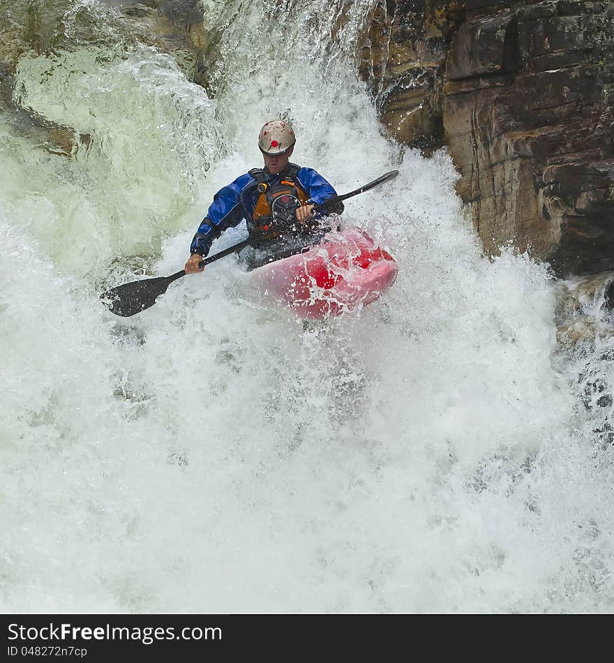 Kayaker in the waterfall