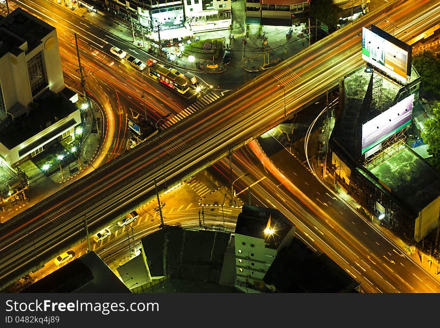 Lights on at night. In the city the car is running. Lights on at night. In the city the car is running.