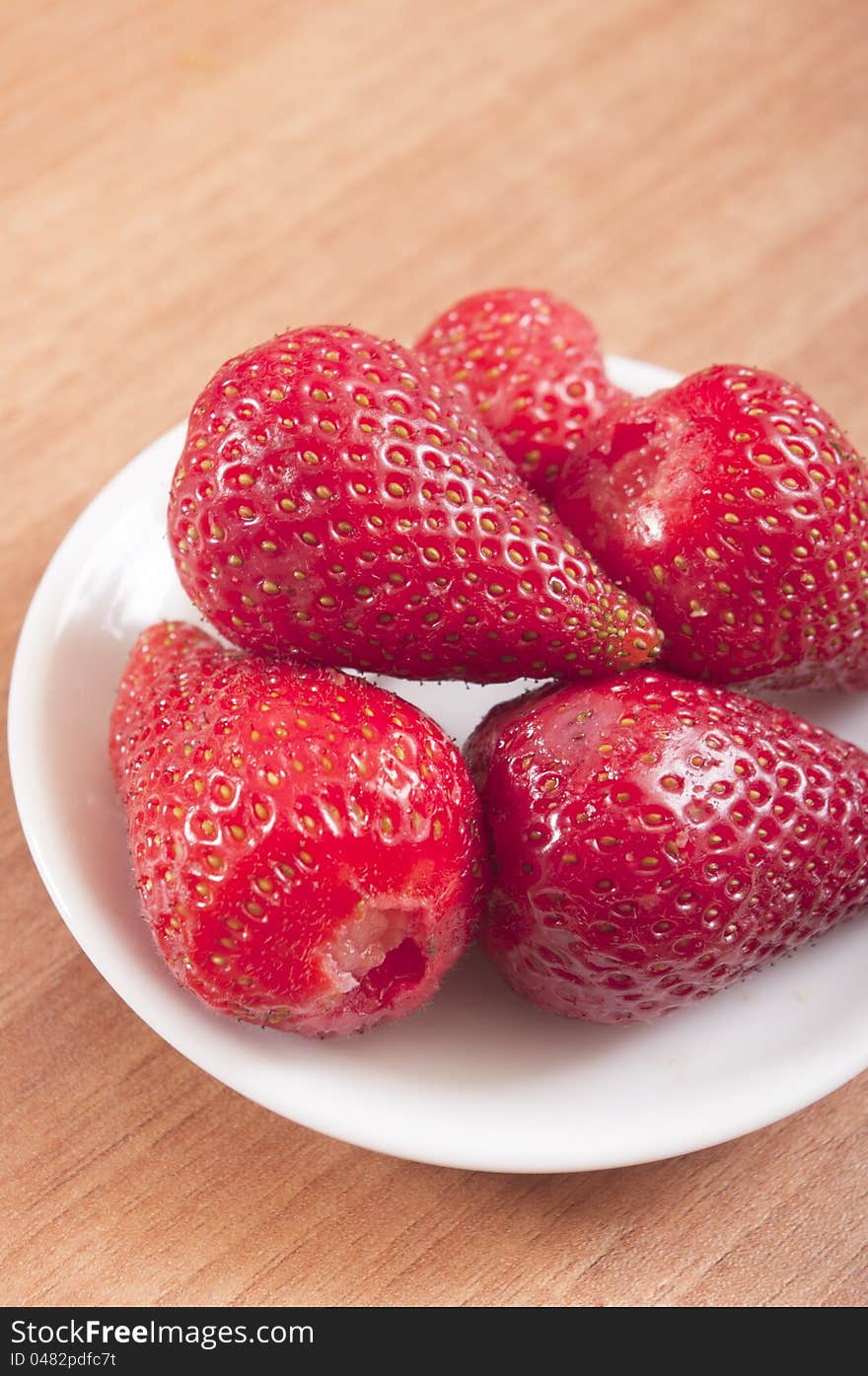 Strawberries  over wood background