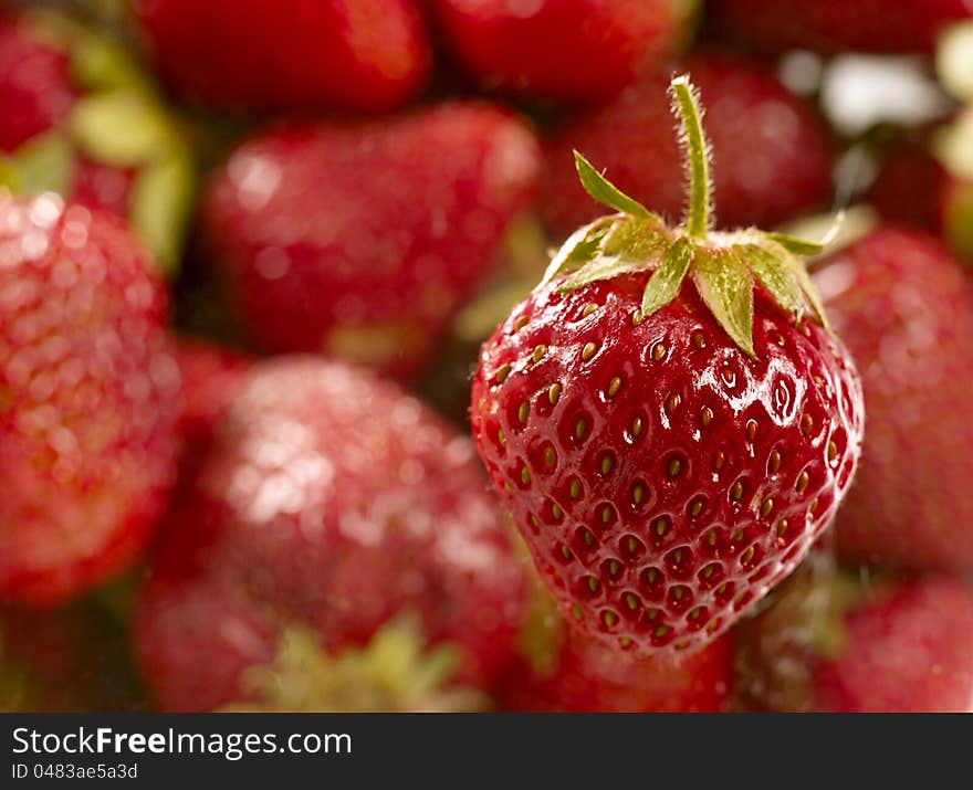 Sweet juicy strawberry over unfocused background