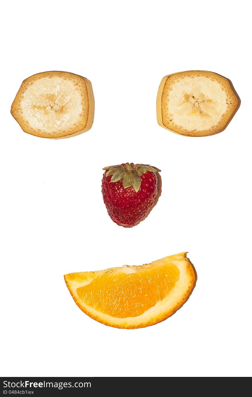 Fruit smiling face with strawberry banana and orange