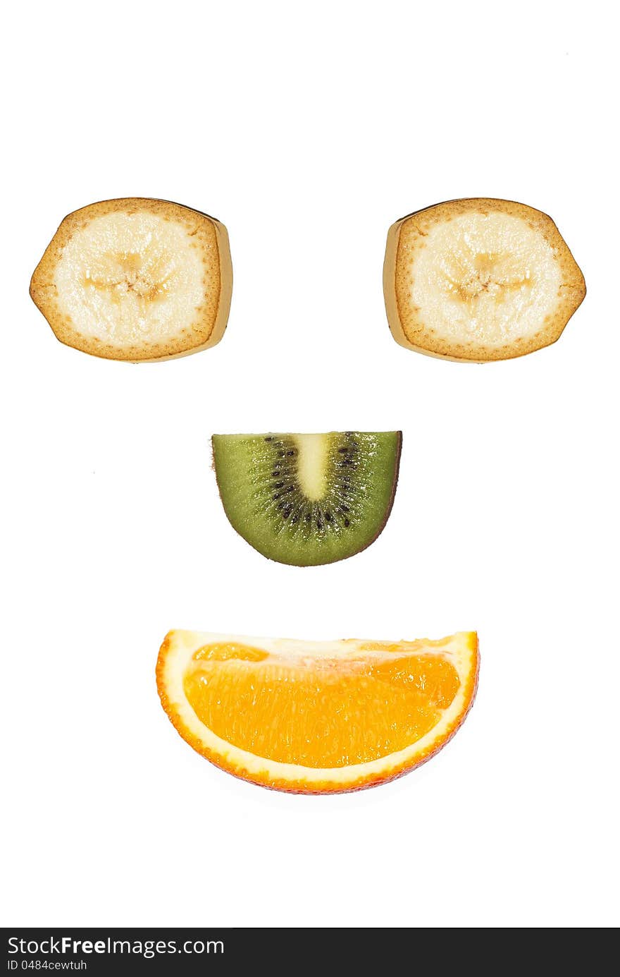 Fruit face from banana kiwi and orange is smiling. Fruit face from banana kiwi and orange is smiling