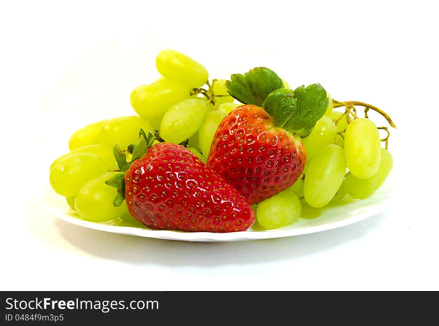 Grapes with strawberry on a white background