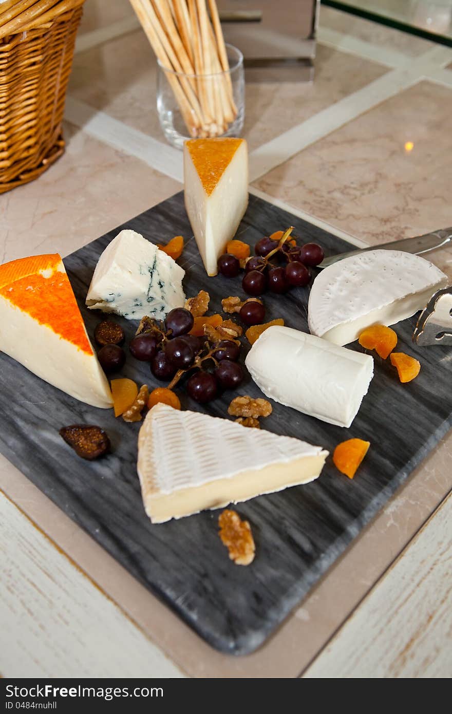 Big group of cheeses with redgrapes. Big group of cheeses with redgrapes