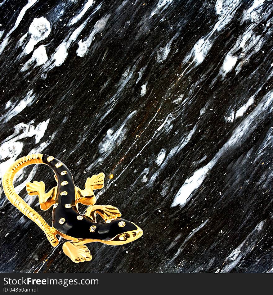 Black wall stone texture gold lizard background