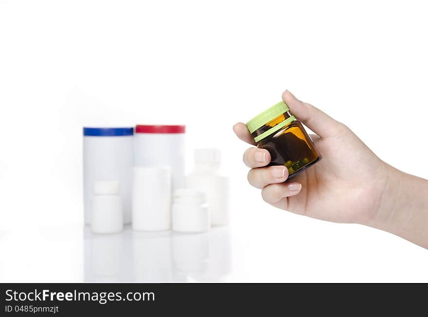 Woman hand holding a bottle of medicine. Woman hand holding a bottle of medicine