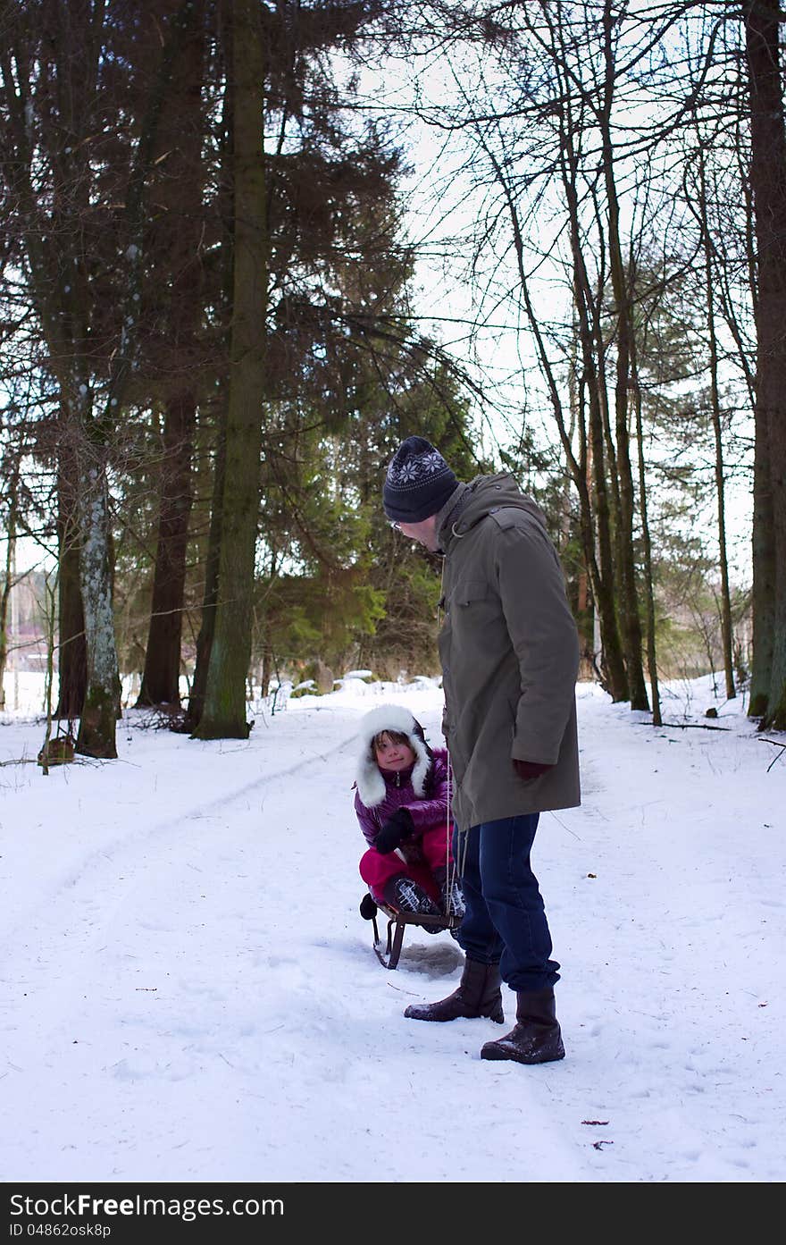 Father with daughter in winter fun