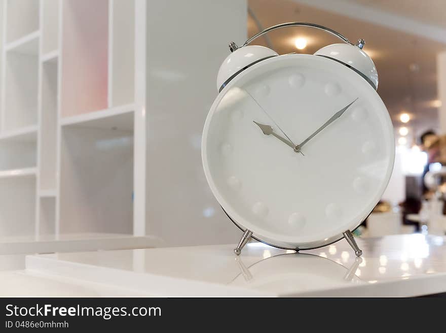 Photos of beautiful white classic alarm clock. Photos of beautiful white classic alarm clock