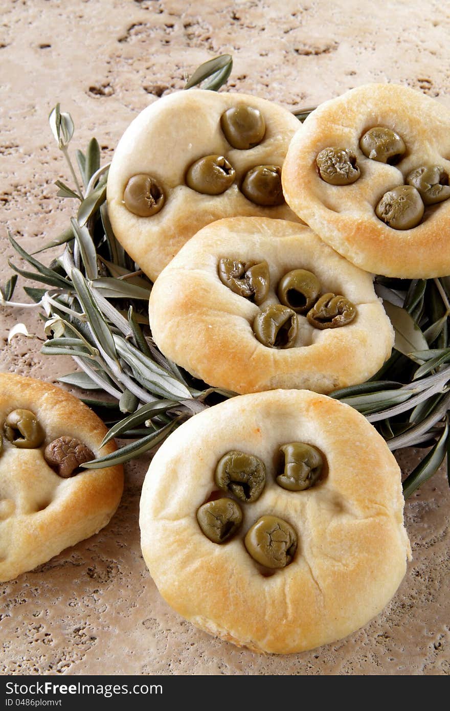 Group of focaccia pizza whit olives on the table