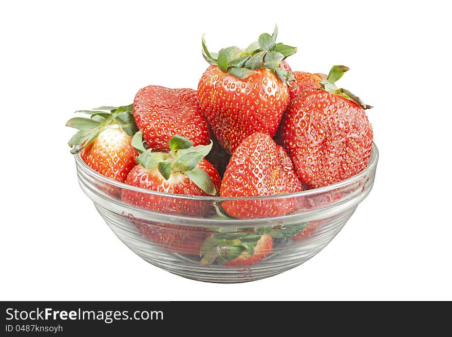 Ripe strawberry in glass bowl isolated over white background. Ripe strawberry in glass bowl isolated over white background