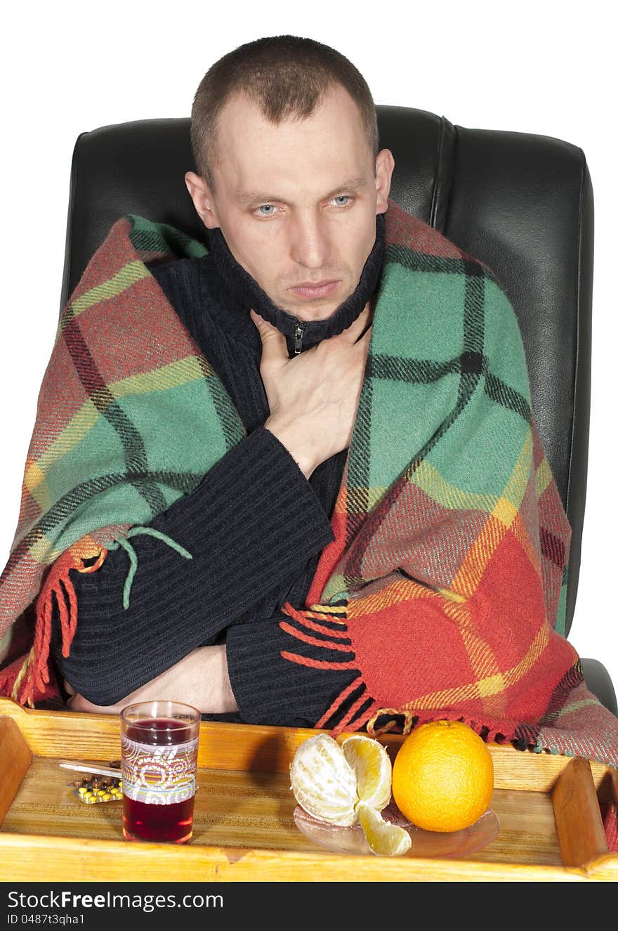 Sick man wrapped in a blanket