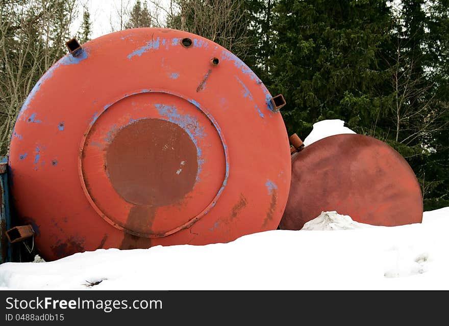 Rusty old industrial drums dumped in a forest. Rusty old industrial drums dumped in a forest