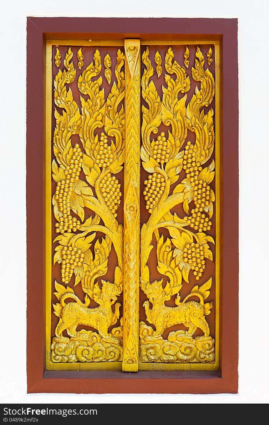 Art of traditional Thai style Carved wooden on door of the temple