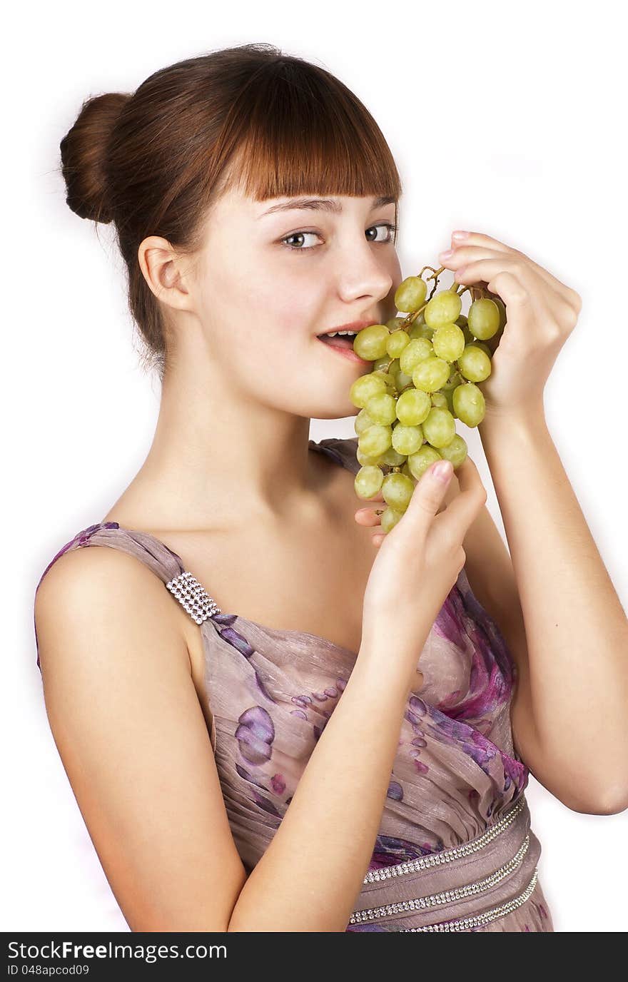 Red pretty woman eating grapes isolated