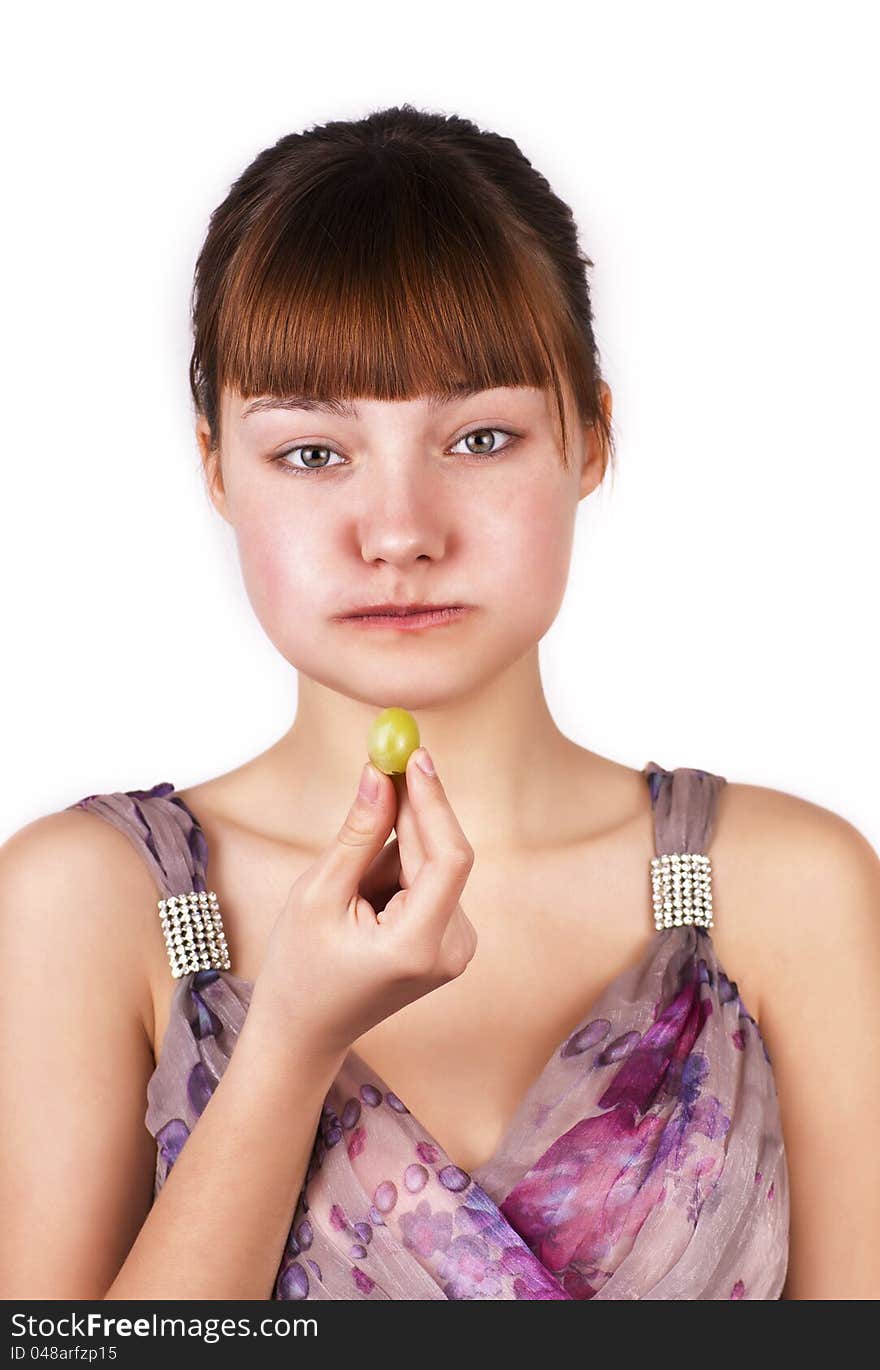 Funny cute girl eating grapes isolated