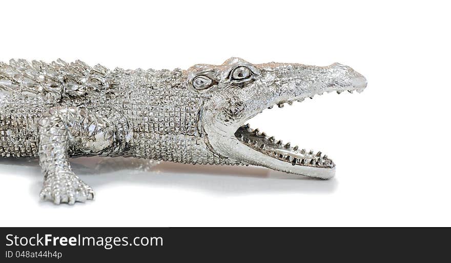 Photos of decorative figurines crocodile on a white background. Photos of decorative figurines crocodile on a white background