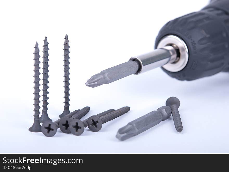 Screws, drill on white background. Screws, drill on white background.