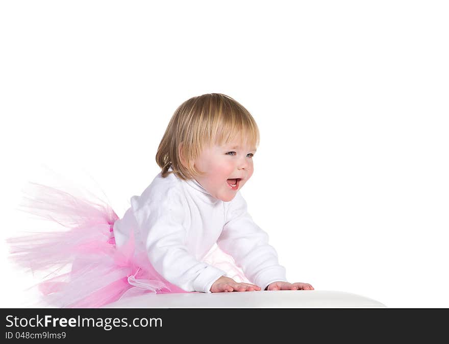 Happy laughing little girl in tutu is based on the cube