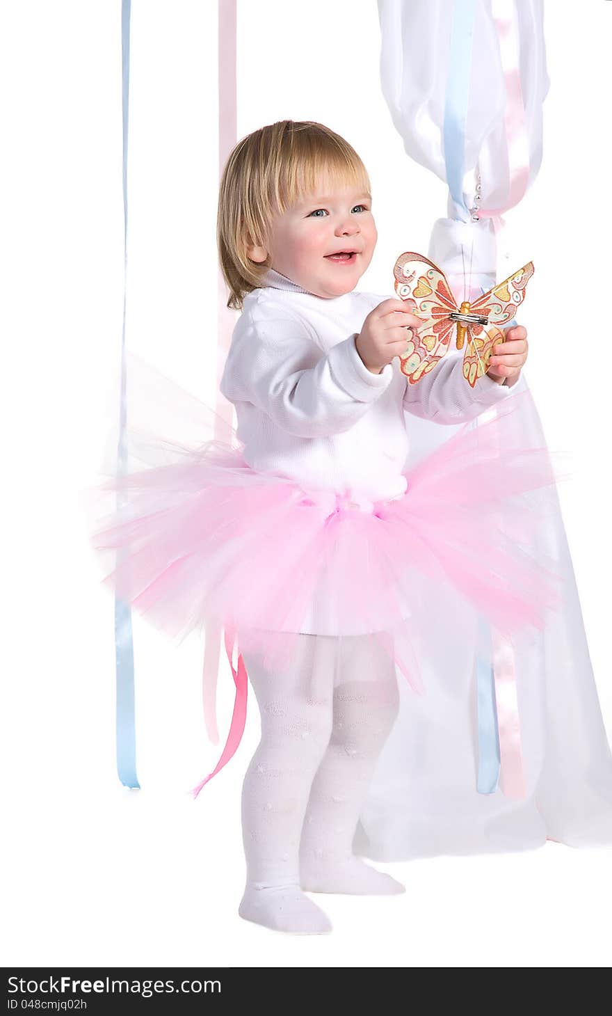 Happy laughing young girl in a pink tutu with butterfly