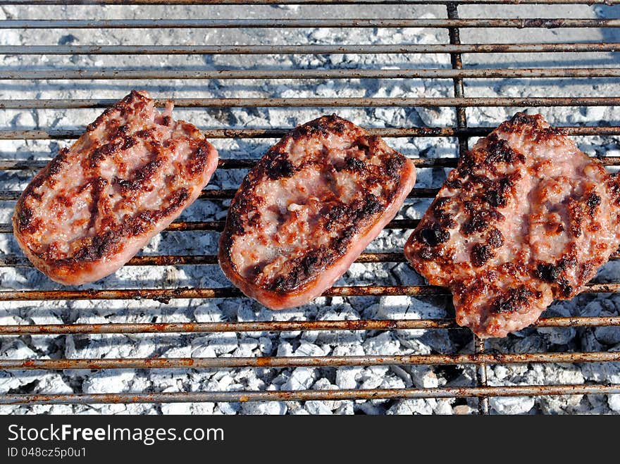 Grilled pork sausage on a barbecue