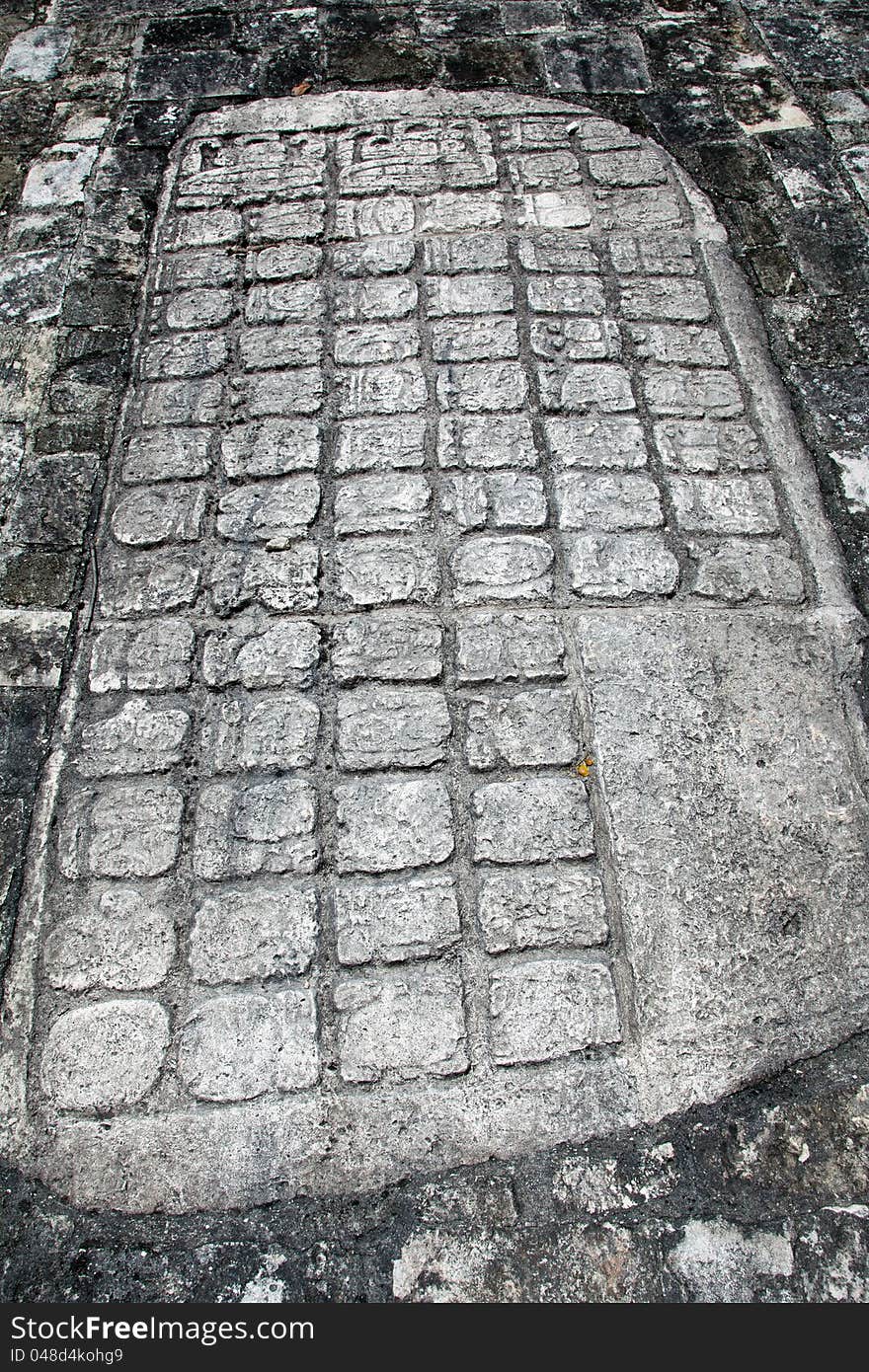 Ancient Mayan Hieroglyphic carving at the Ball Court in Coba, Mexico. Ancient Mayan Hieroglyphic carving at the Ball Court in Coba, Mexico