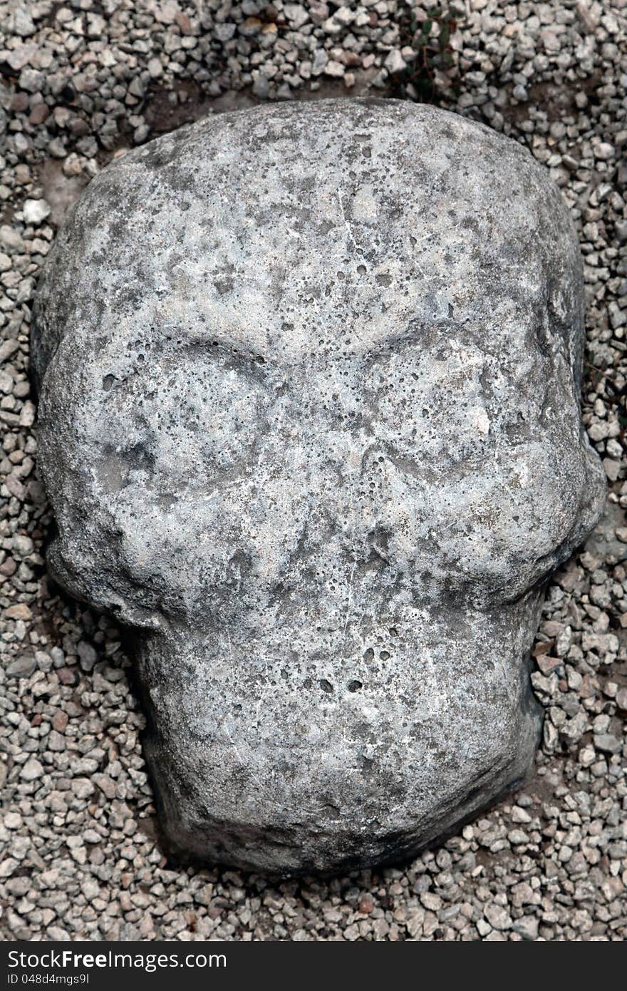 Carved skull at the Ball Court in the ruins of the ancient Mayan city of Coba, Mexico