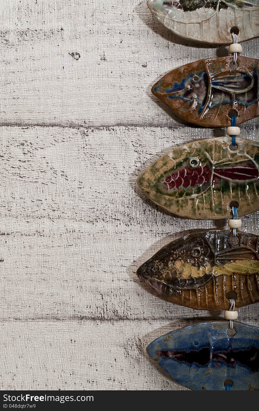 Half Fish Body Pottery On Wooden Background