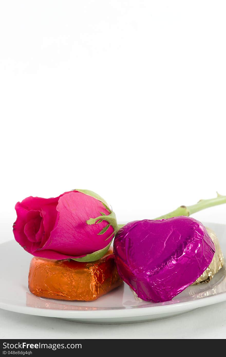 Chocolate heart and rose in the Valentine's Day, white background. Chocolate heart and rose in the Valentine's Day, white background