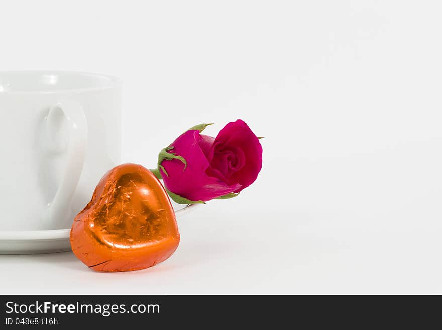 Chocolate heart and rose in the Valentine's Day, white background. Chocolate heart and rose in the Valentine's Day, white background