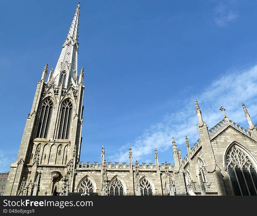 Looking upward at a church in blues sky and wispy clouds. Looking upward at a church in blues sky and wispy clouds