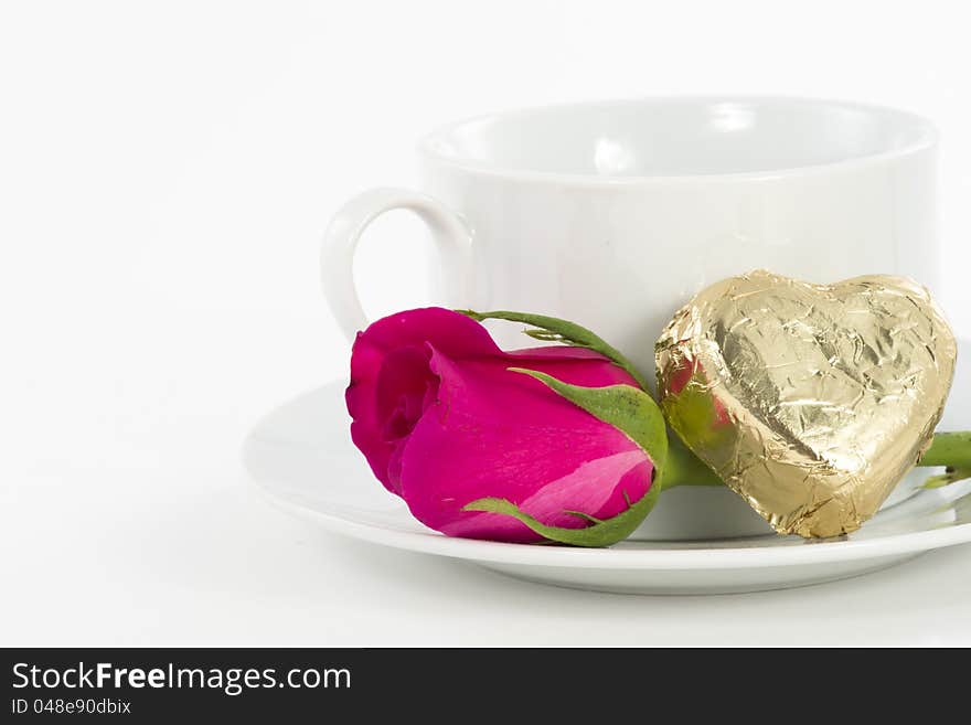 Chocolate heart and rose in the Valentine's Day, white background. Chocolate heart and rose in the Valentine's Day, white background