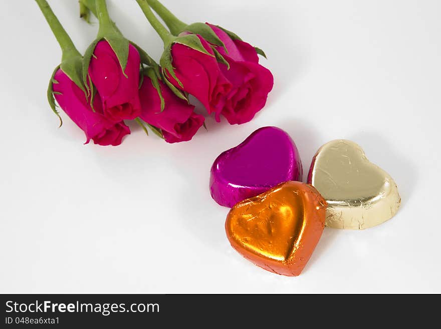 Chocolate heart and rose in the Valentine's Day, White background. Chocolate heart and rose in the Valentine's Day, White background