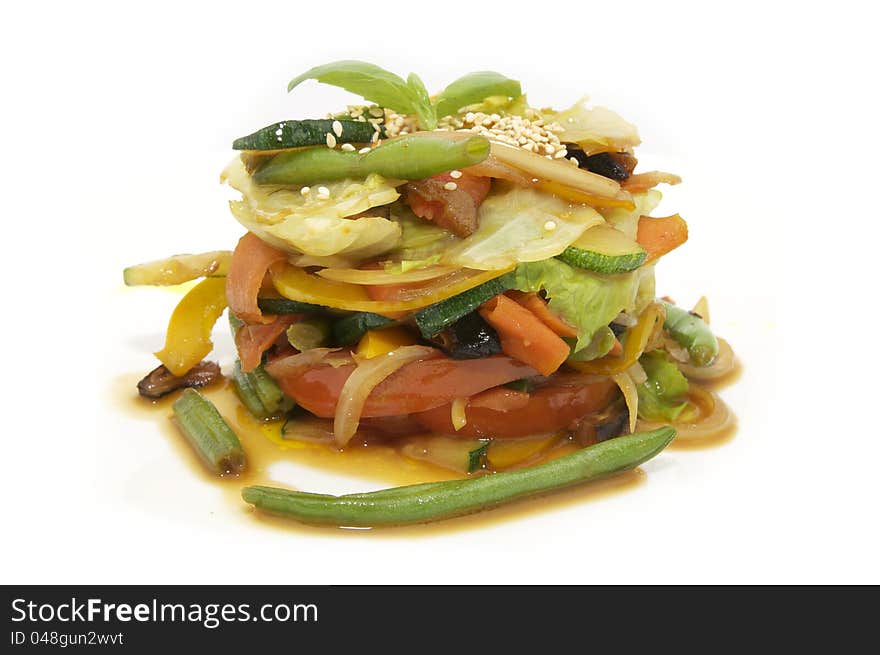 Salad vegetables and greens on a white background. Salad vegetables and greens on a white background