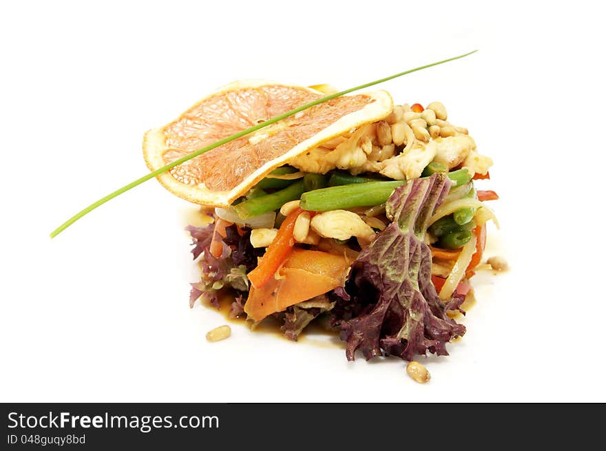 Salad with chicken and vegetables decorated with green onions and croutons