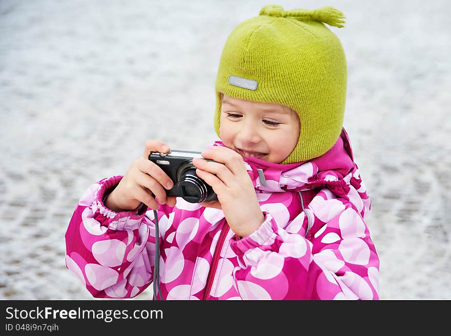 Funny little girl with camera