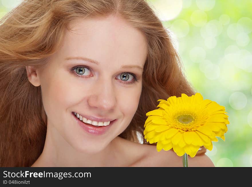 Beautiful  girl with yellow gerbera flower