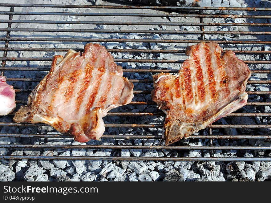 Grilled pork chops on a barbecue