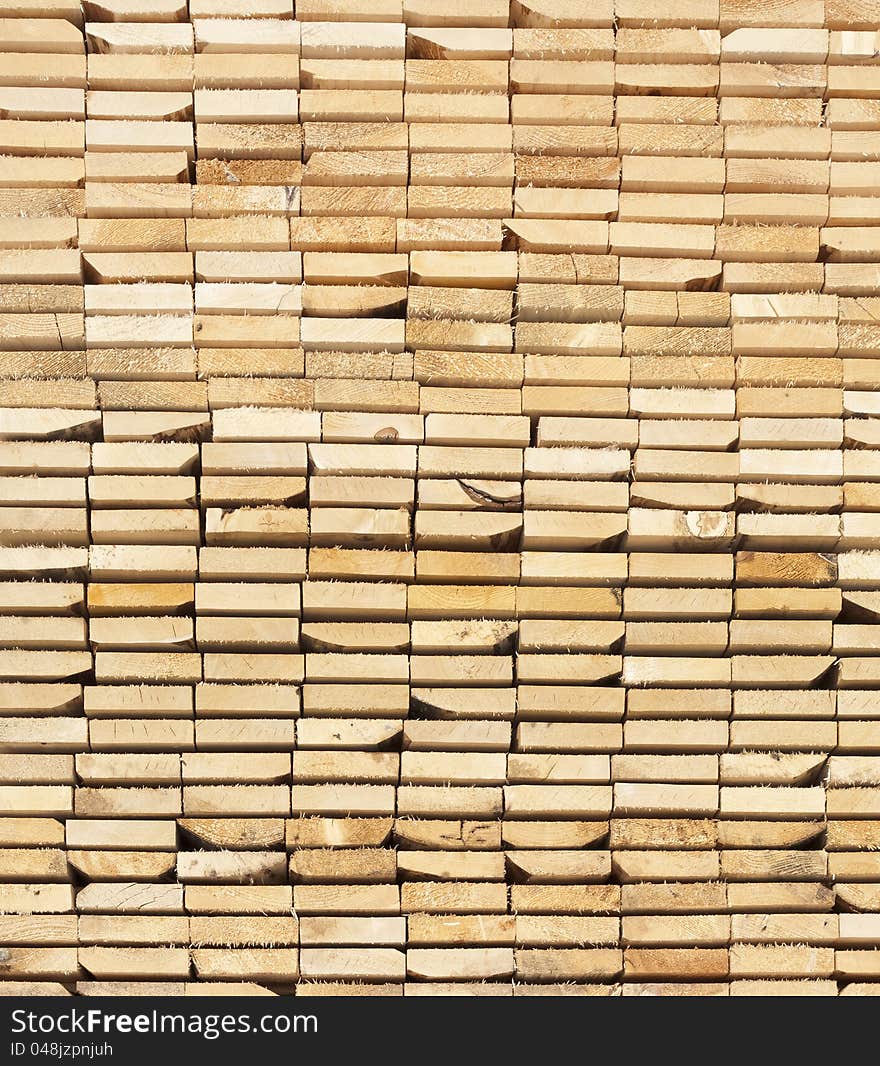 Background  of a stack  Of Wooden Boards From Ends